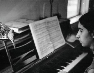 Girl and parakeet at piano